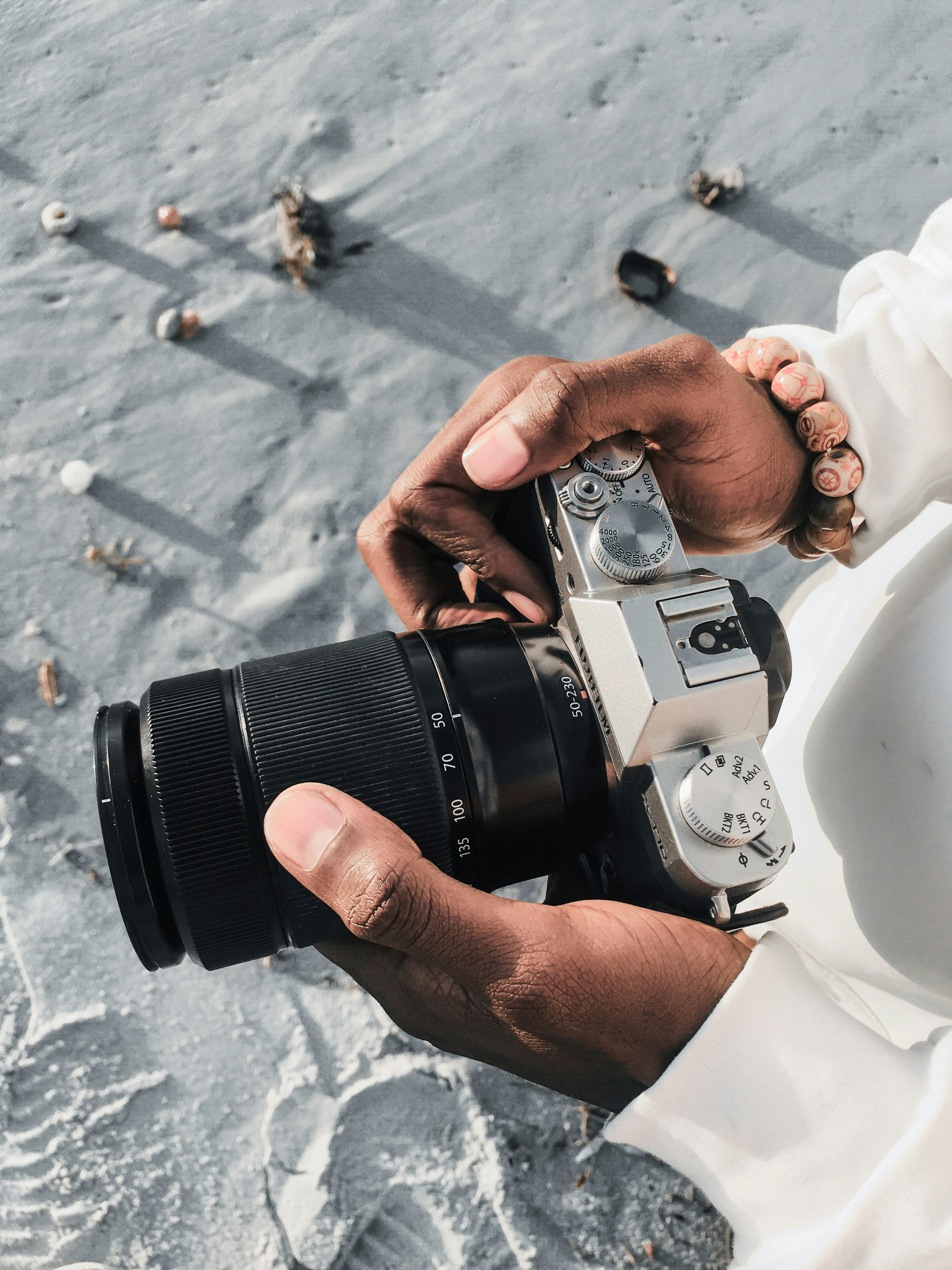 person holding black and silver dslr camera